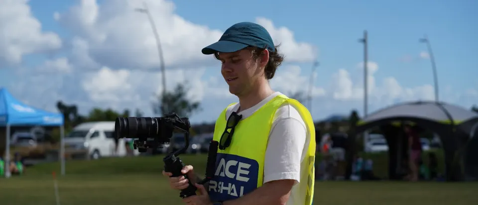 Mitchell Carlyle filming on a gimbal at an outdoor event